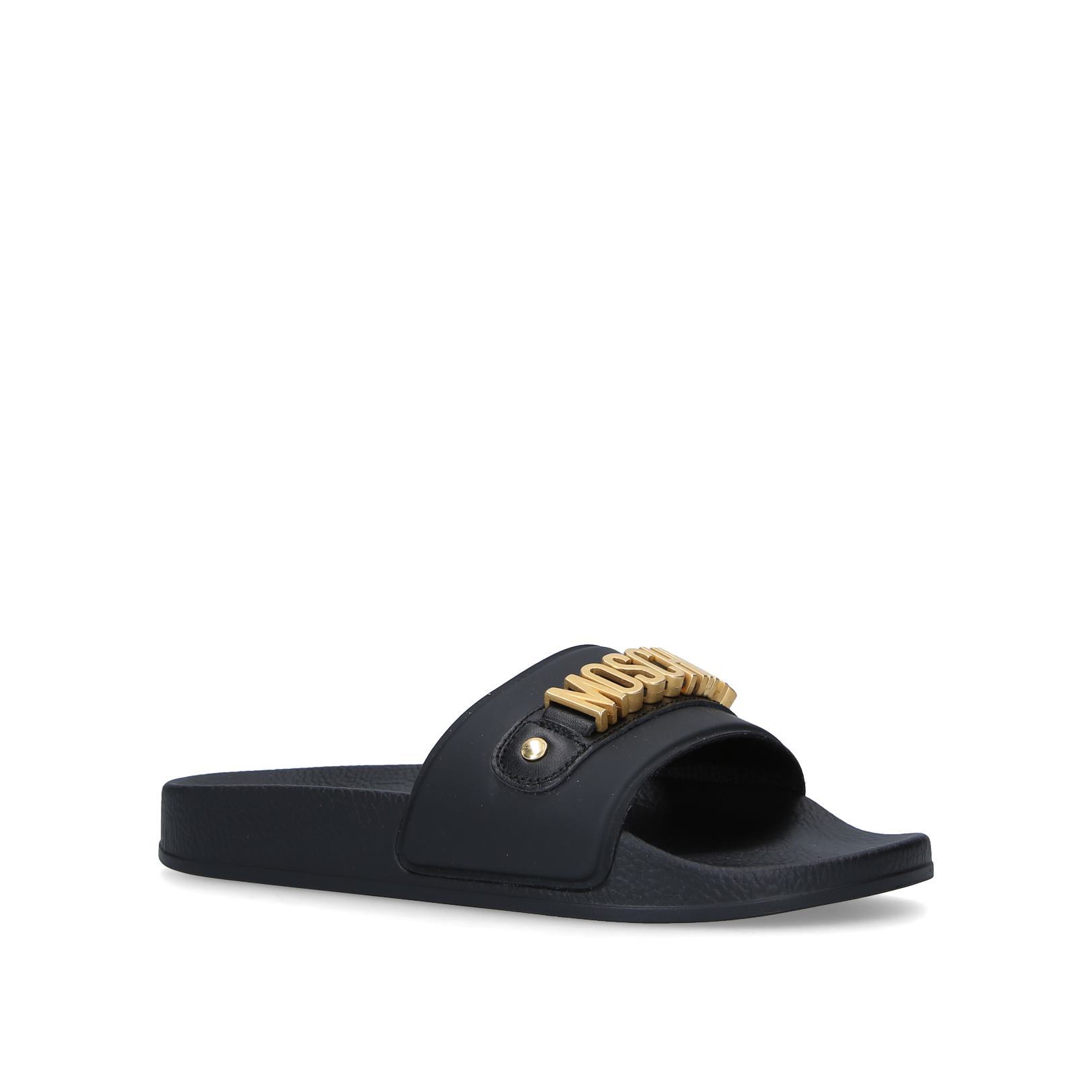 moschino monogram leather slides