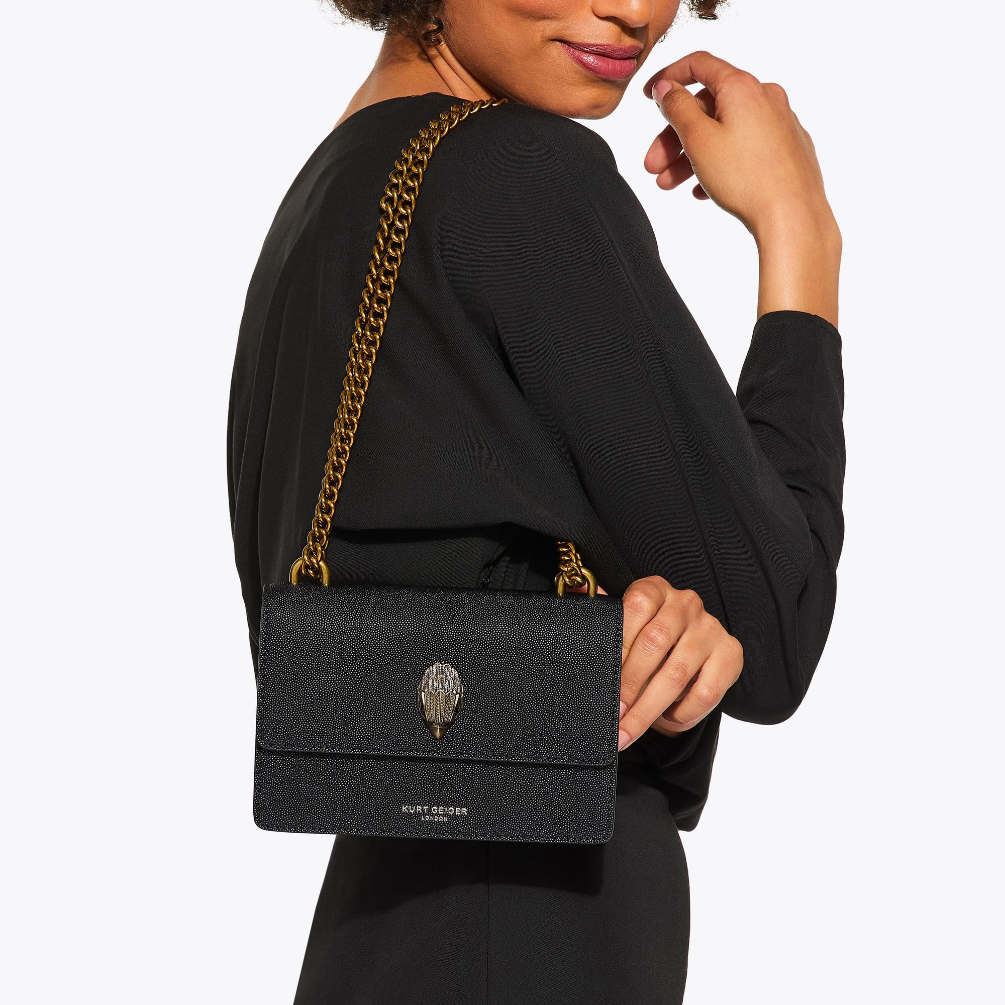 Leather crossbody bag with all-over embossed eagle
